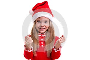 Christmas girl clenching the fists, wearing a santa costume, isolated over a white background