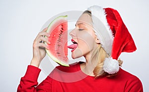 Christmas girl eat watermelon. Prolong summer. Travel christmas vacation and holidays resort. Delicious christmas photo