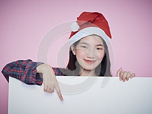 Christmas girl holding blank poster
