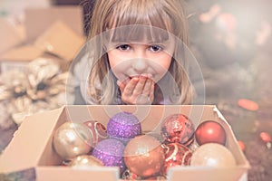 Christmas girl looking at decorations portrait