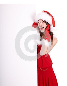 Christmas girl in santa hat with banner.