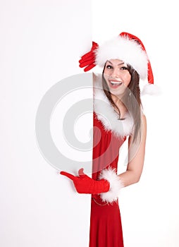 Christmas girl in santa hat with banner point.