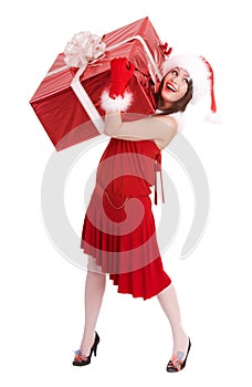 Christmas girl in santa hat with big gift box.