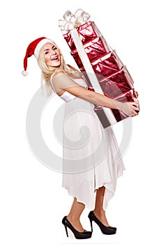 Christmas girl in santa hat holding red gift box.