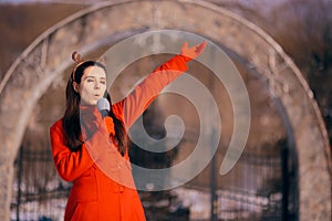 Christmas Girl Singing Carols Outdoors in Wintertime