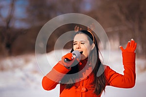 Christmas Girl Singing Carols Outdoors in Wintertime