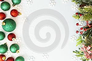 Christmas glitered green and red baubles, balls isolated on snow. Winter abstract border mockup