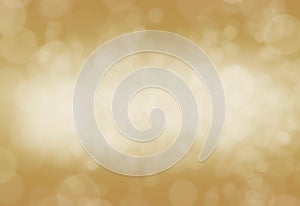 Christmas glowing golden background. Gold holiday New year abstract glitter defocused background