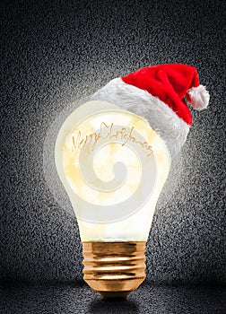 Christmas Glowing Light Bulb With Santa Hat And Copy Space