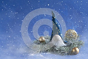 Christmas  gnome Gonk wearing a blue hat  with long beard. New year and Christmas greeting card design