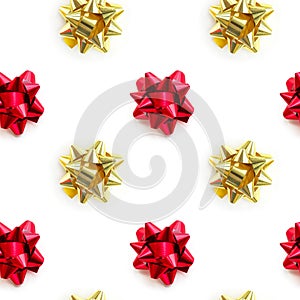 Christmas gold and red ribbon bow pattern on white background. Design composition