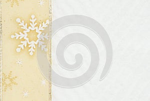 Christmas gold ribbon on white chevron textured fabric background