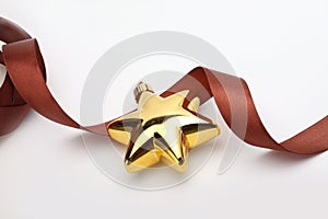 Christmas gold star with brown ribbon