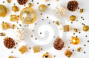 Christmas golden background, christmas decoration, cones, balls, glitter, flat lay