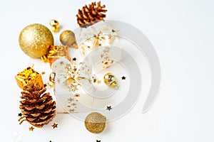 christmas golden background, christmas decoration, cones, balls, glitter, flat lay