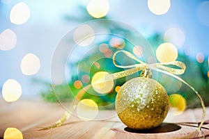 Christmas golden ball on abstract background copyspace