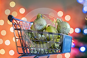 Christmas Golden balls in the shopping basket.