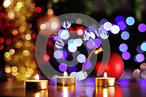 Christmas golden candles and glittering tree and baubles