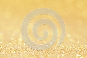 Christmas golden glowlight glitter blur bokeh abstract  background.for holiday xmas and happy new year backdrop,luxury celebration