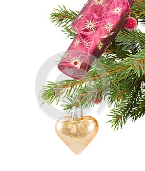 Christmas golden heart hanging on fir tree