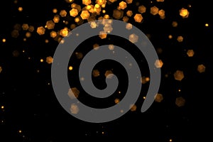 Christmas golden light shine particles bokeh loopable from top on black background, holiday congratulation greeting party happy ne