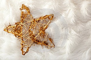 Christmas golden star over white fur