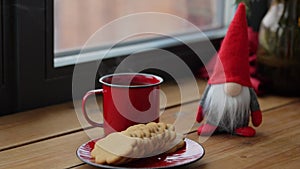 christmas gonk, coffee and cookies on window sill