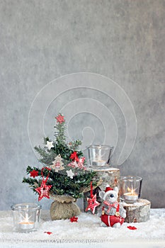 Christmas gray background with candles and tree