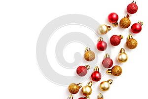 Christmas greating card composition. Christmas red and golden decorations on white background. Flat lay, top view, copy space