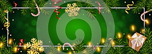 Christmas green background with realistic pine branches, shining garlands, gifts box, candy, glitter gold snowflake, tinsel.