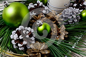 Christmas green ornament and snowy decorated pine cones