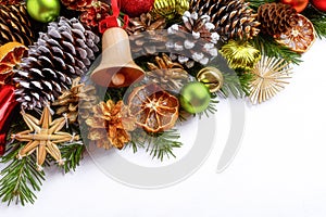 Christmas greeting background with jingle bell and spruce cones