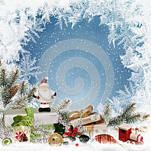 Christmas greeting background with space for text, with gifts, sweets, Santa Claus, pine branches, Christmas decorations and frost photo