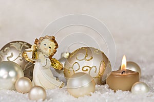 Christmas greeting card with angel and candle in gold, silver an