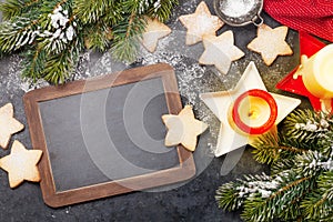 Christmas greeting card with fir tree, cookies and candles