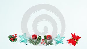 Christmas greeting card. Frame of spruce twigs, Christmas decorations and toy on white background