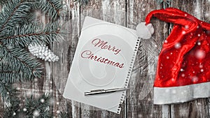 Christmas greeting card on old wooden background with space where you can leave a message for Santa.