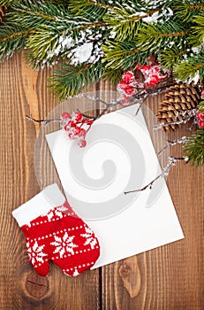 Christmas greeting card or photo frame over wooden table with sn