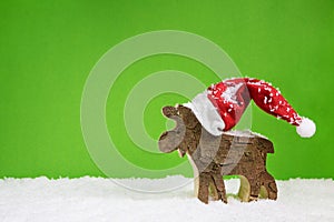 Christmas greeting card with reindeer in green red and white col