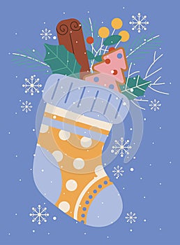 Christmas greeting card with sock and decor, twigs, snowflakes, cookies, leaves, cinnamon, berries, fir tree.