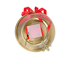 Christmas Greeting card template. Empty paper note in a gold plate isolated on white