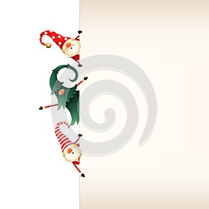 Christmas greeting card template. Three Christmas Gnomes peeking behind signboard on transparent background photo