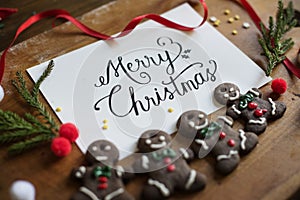 Christmas greeting card on wooden table