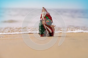 Christmas greeting cards design. Santa Claus on sea beach. Happy New Year and merry Christmas travel, tropical vacations
