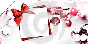 christmas greeting gift card with red ribbon bow and holly berries background white template copy space