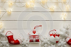 Christmas hand made decoration on wooden background with lights