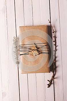 Christmas handcraft gift box on wood background.