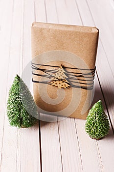 Christmas handcraft gift box on wood background.