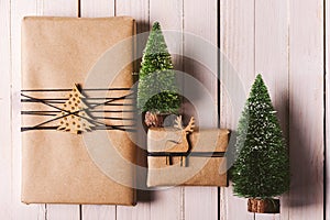 Christmas handcraft gift boxes on wood background.