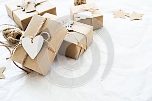 Christmas handmade gift boxes on white background. Merry Christmas greeting card, frame. Winter xmas holiday theme.